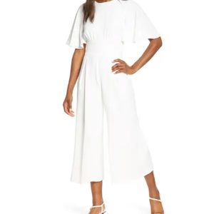 Gorgeous white jump suit. Doesn’t fit post baby. Never worn. New with tags